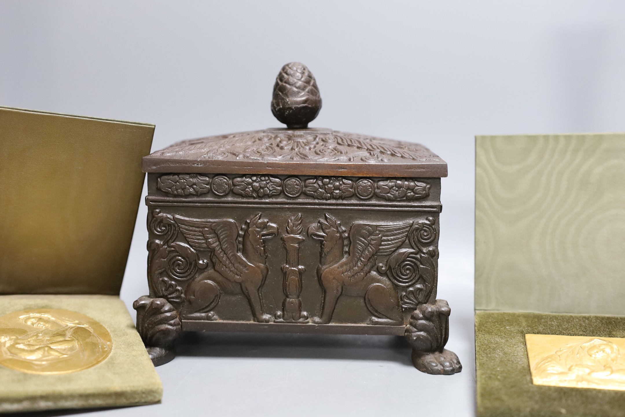 A German Babcock Werke cigarette box, together with mixed pewter, a pair of plated candlesticks and three religious relief plaques